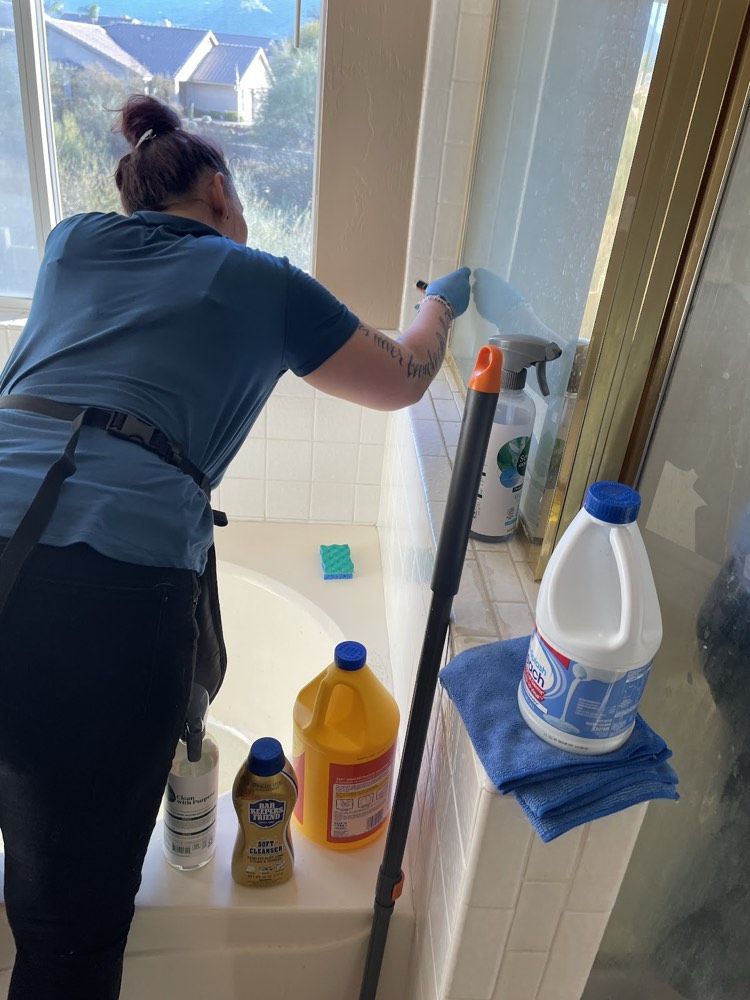 House cleaner from Spotless House Cleaning Sugar Land cleaning a home in Riverstone